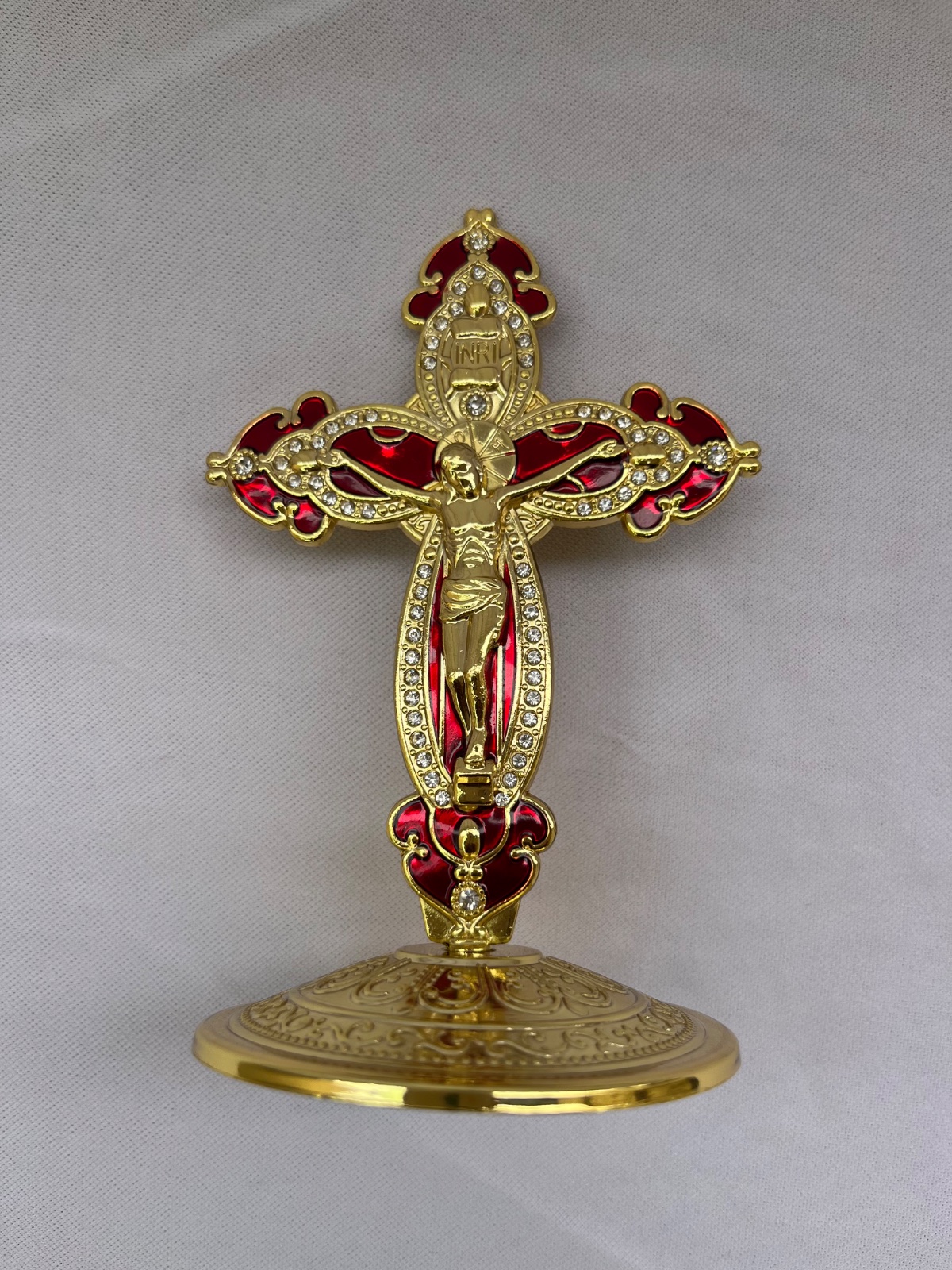gold colored standing crucifix cross